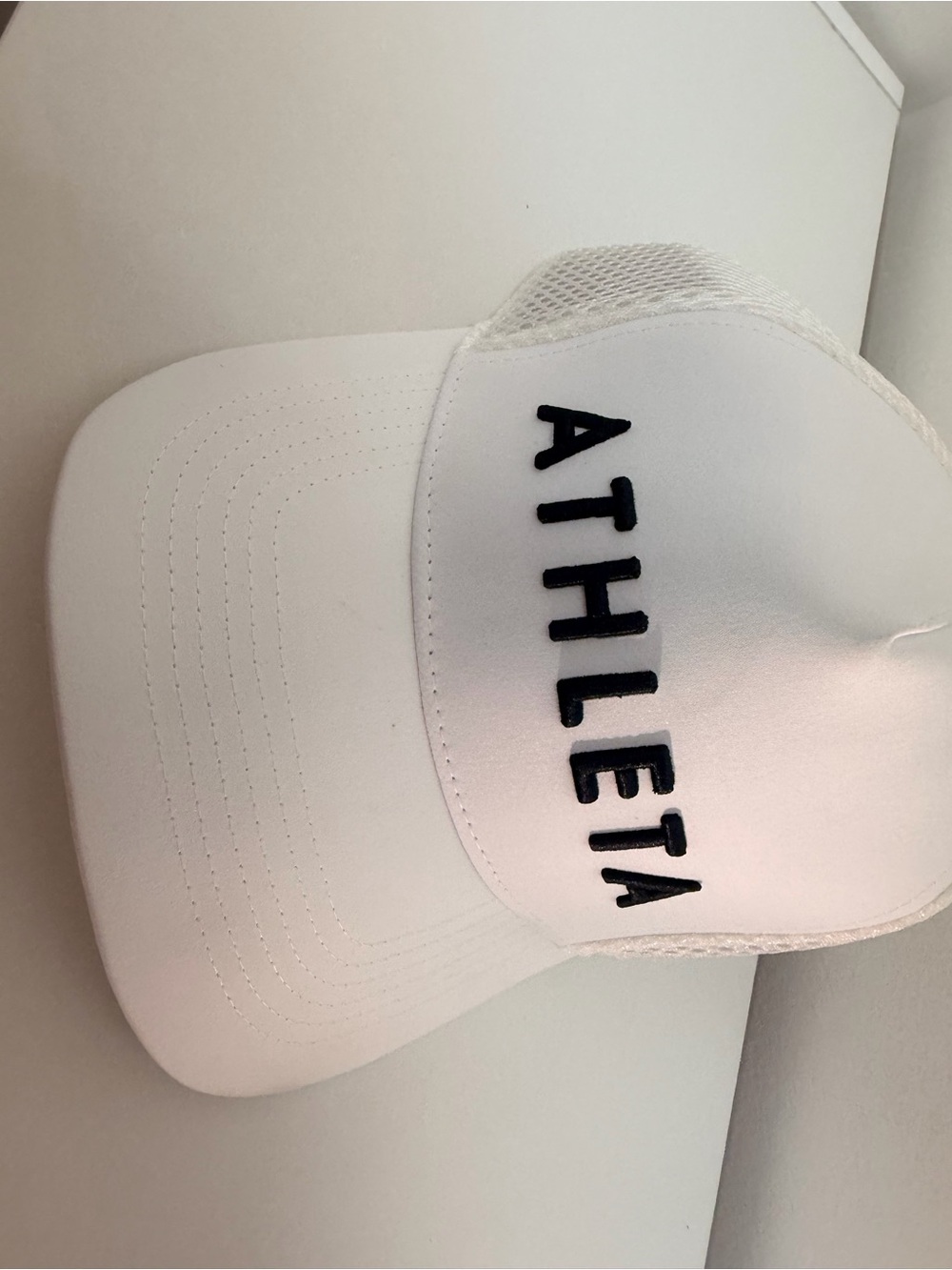 Athleta White woman Mesh Trucker Hat with Black Logo